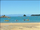 Kayakers leaving Mosquito Bay, Abel Tasman